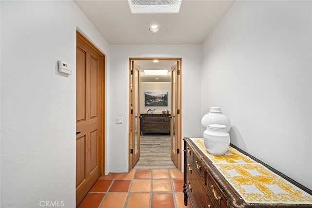 hallway with light tile patterned flooring