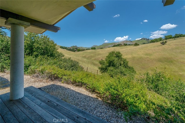 exterior space with a rural view and a wooden deck