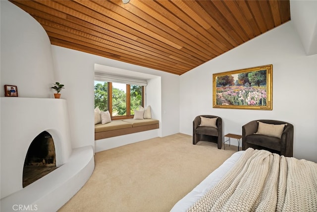 carpeted bedroom featuring wood ceiling and vaulted ceiling