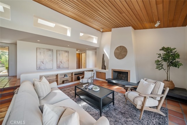 living room with wooden ceiling and tile patterned floors