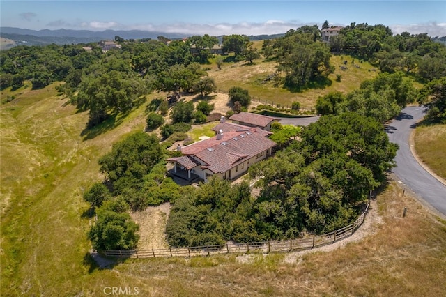 birds eye view of property with a rural view