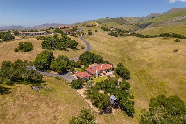 drone / aerial view featuring a mountain view and a rural view