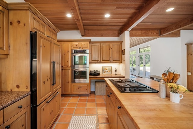 kitchen featuring wood ceiling, black electric stovetop, beam ceiling, and stainless steel double oven