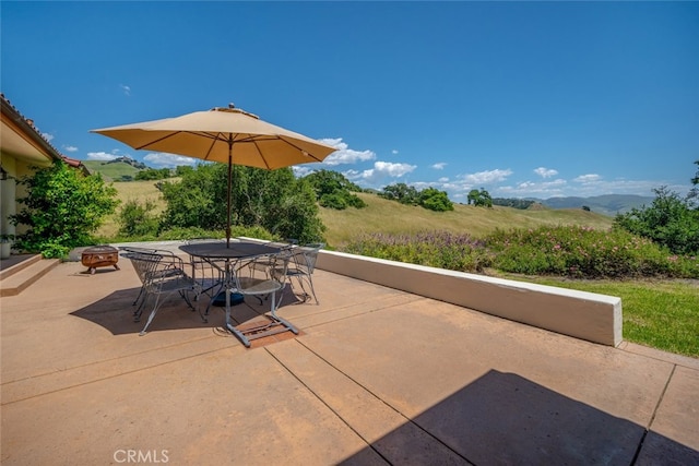 view of patio / terrace with a mountain view