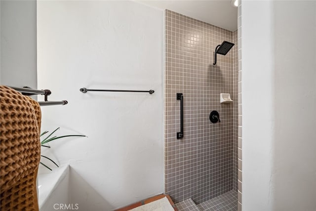 bathroom with tiled shower