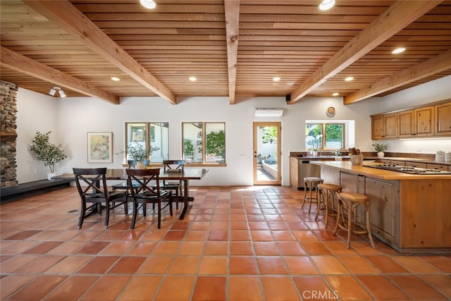 tiled dining area with beam ceiling and wooden ceiling