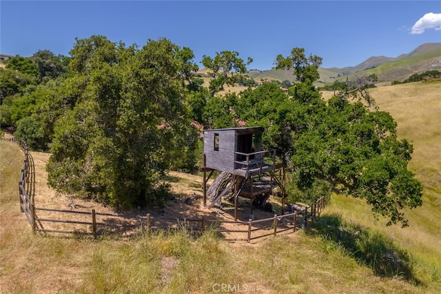 exterior space with a mountain view and a rural view