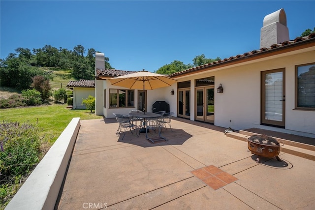 view of patio / terrace with a fire pit