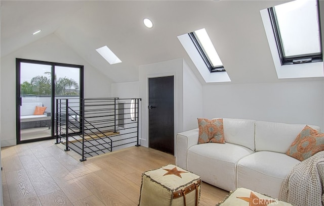 living room with lofted ceiling and light hardwood / wood-style flooring