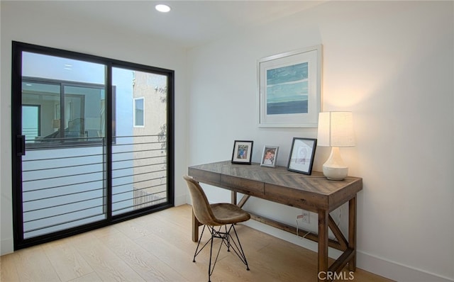 office with light hardwood / wood-style floors