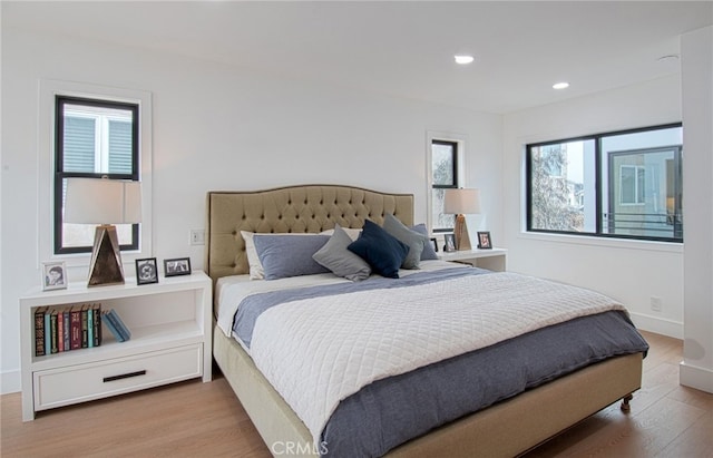 bedroom with wood-type flooring