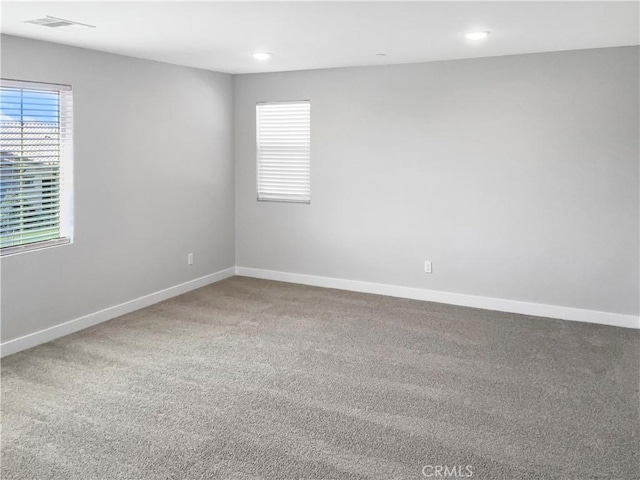 spare room featuring carpet