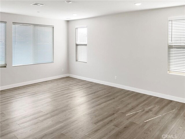 empty room featuring dark hardwood / wood-style flooring