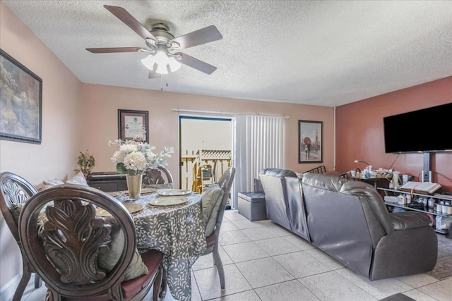 tiled living room featuring a textured ceiling and ceiling fan