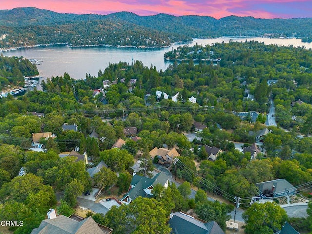 aerial view at dusk with a water view