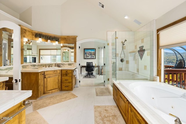 bathroom with vanity, shower with separate bathtub, high vaulted ceiling, and tile patterned floors