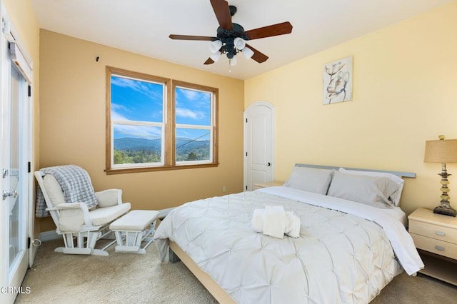 bedroom with ceiling fan and carpet