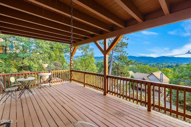 wooden terrace with a mountain view