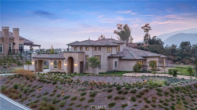 mediterranean / spanish home featuring a mountain view