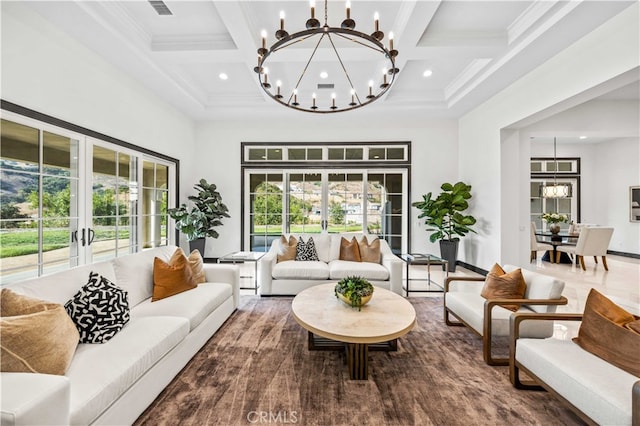 living room with ornamental molding, beamed ceiling, coffered ceiling, and a chandelier