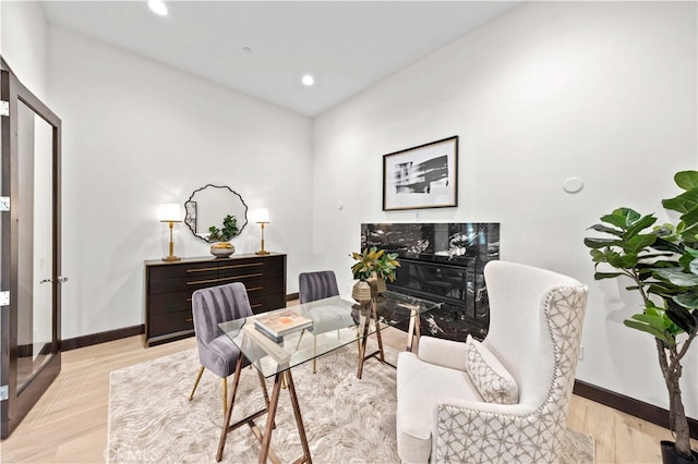 sitting room featuring light hardwood / wood-style floors