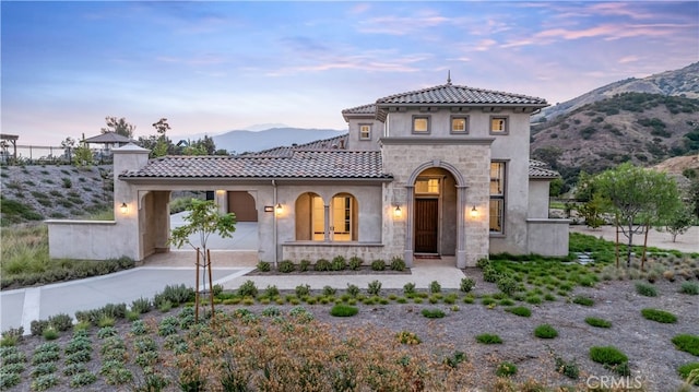 mediterranean / spanish-style home with a mountain view