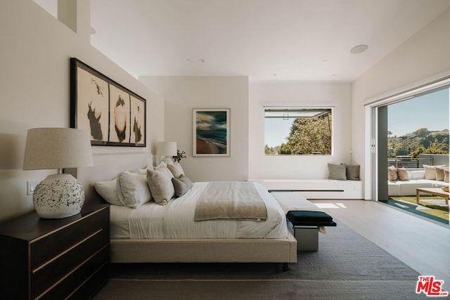 bedroom featuring dark hardwood / wood-style flooring