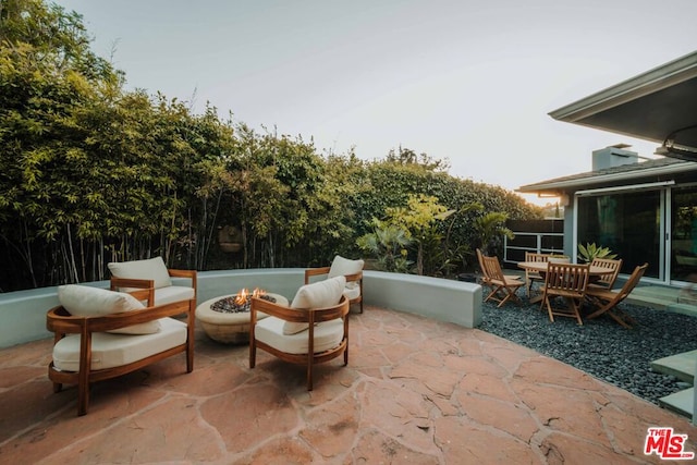 view of patio / terrace with an outdoor fire pit