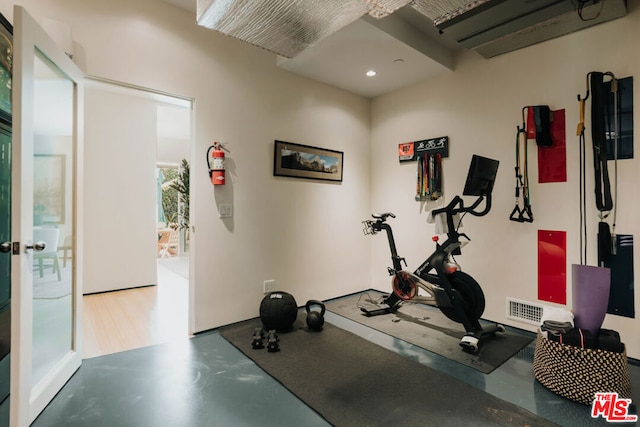 workout area with concrete floors