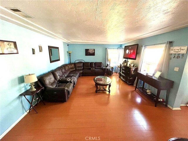 living room with a textured ceiling