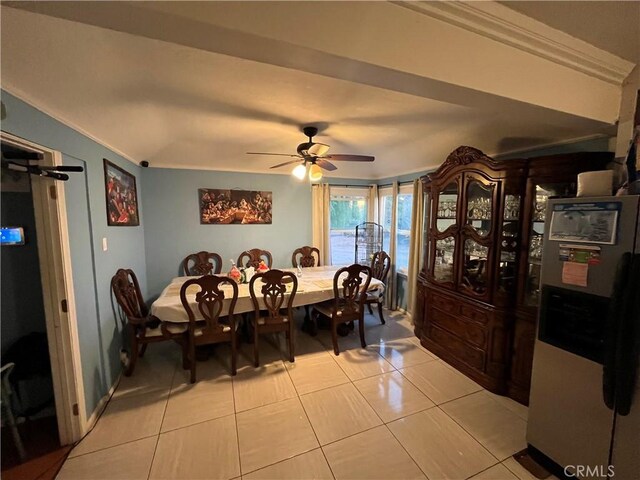 dining space featuring ceiling fan and light tile patterned flooring