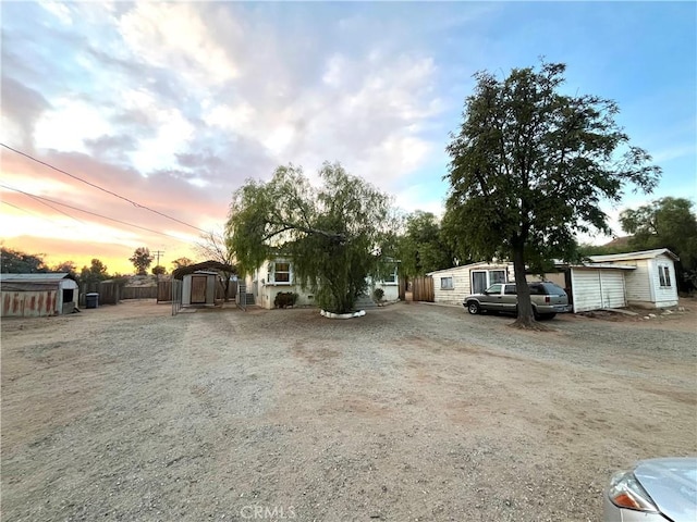 view of front of house with a storage shed