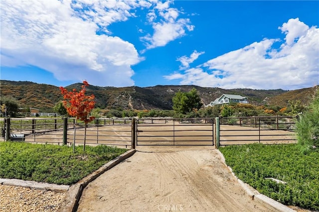 view of mountain feature with a rural view