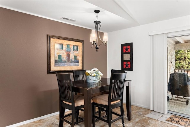 dining room with a chandelier