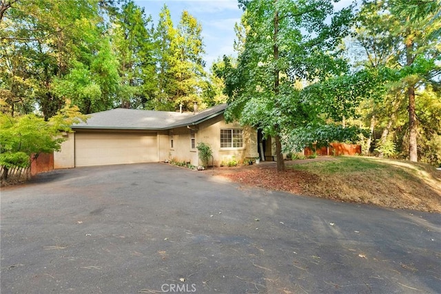 ranch-style home with a garage