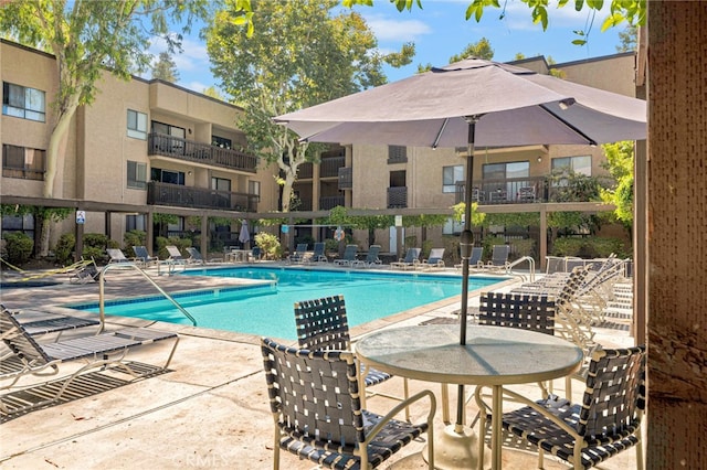 view of pool featuring a patio area