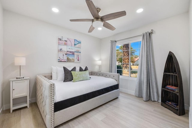 bedroom featuring light hardwood / wood-style floors and ceiling fan