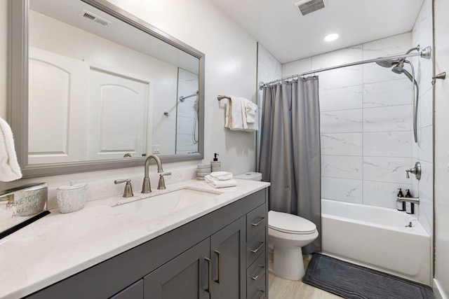 full bathroom with hardwood / wood-style floors, vanity, toilet, and shower / bathtub combination with curtain