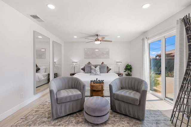 bedroom featuring access to outside, ceiling fan, and hardwood / wood-style flooring