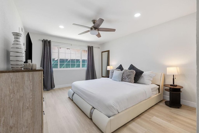 bedroom featuring ceiling fan and light wood-type flooring