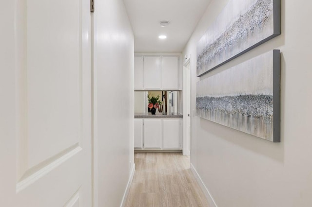 corridor featuring light hardwood / wood-style flooring