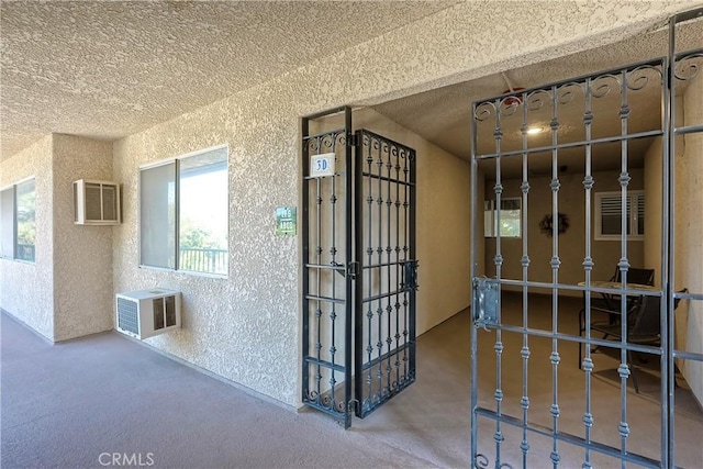 interior space featuring a wall mounted air conditioner