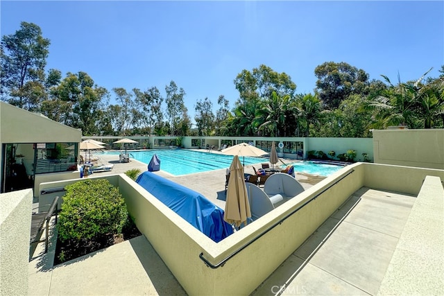 view of swimming pool featuring a patio