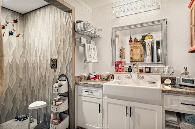 bathroom featuring vanity, tile walls, and crown molding