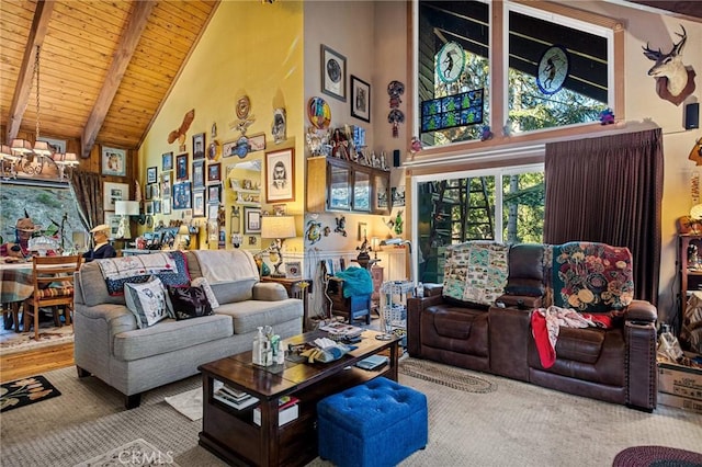 carpeted living room with beamed ceiling, wooden ceiling, and high vaulted ceiling