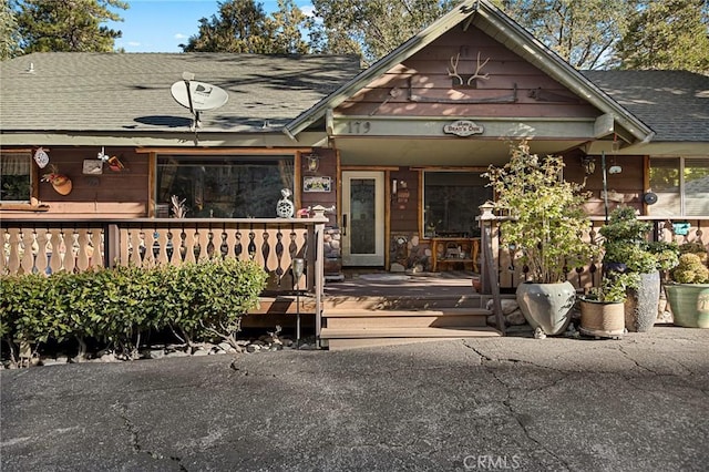 179 Golf Course Rd, Lake Arrowhead, CA 92317 - view of front of house with a shingled roof and covered porch
