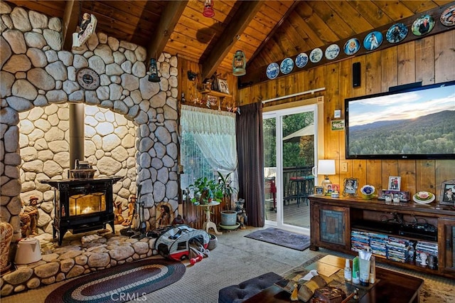 179 Golf Course Rd, Lake Arrowhead, CA 92317 - living room with a wood stove, a wood ceiling with exposed beams, carpet flooring, wood walls, and high vaulted ceiling