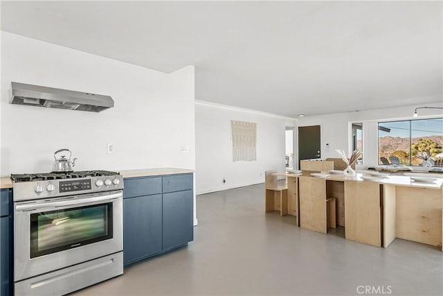 kitchen featuring gas stove, concrete flooring, and range hood