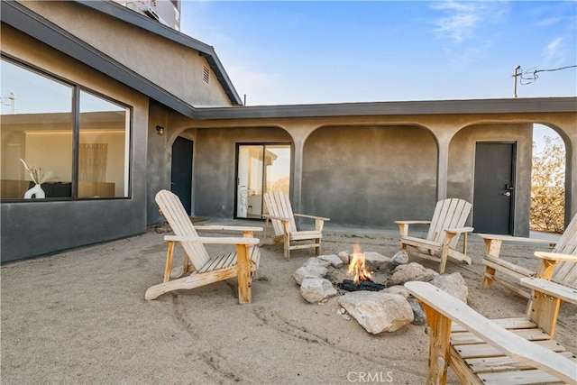 view of patio / terrace featuring a fire pit