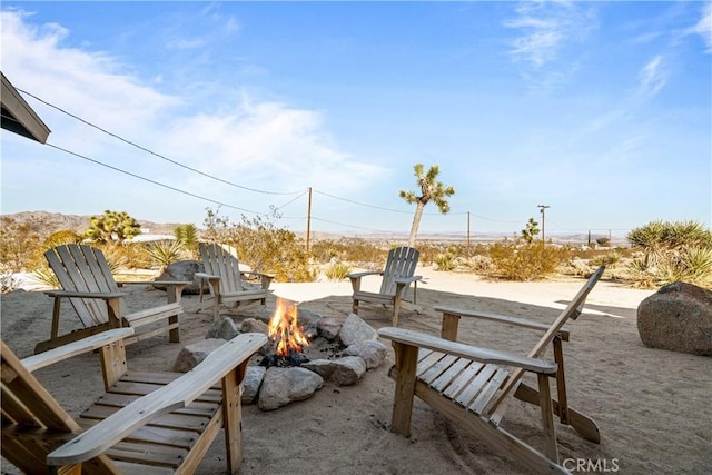 view of patio with a fire pit